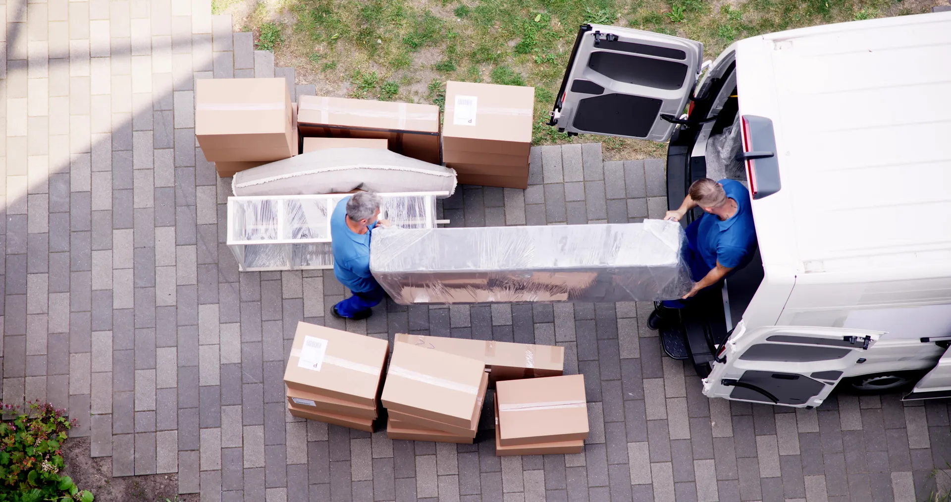 2-man delivery team unloading furniture